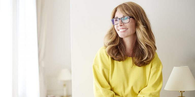 Woman Smiling Looking Into The Distance