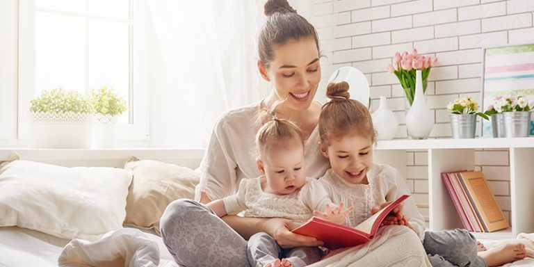 mum reading to daughters