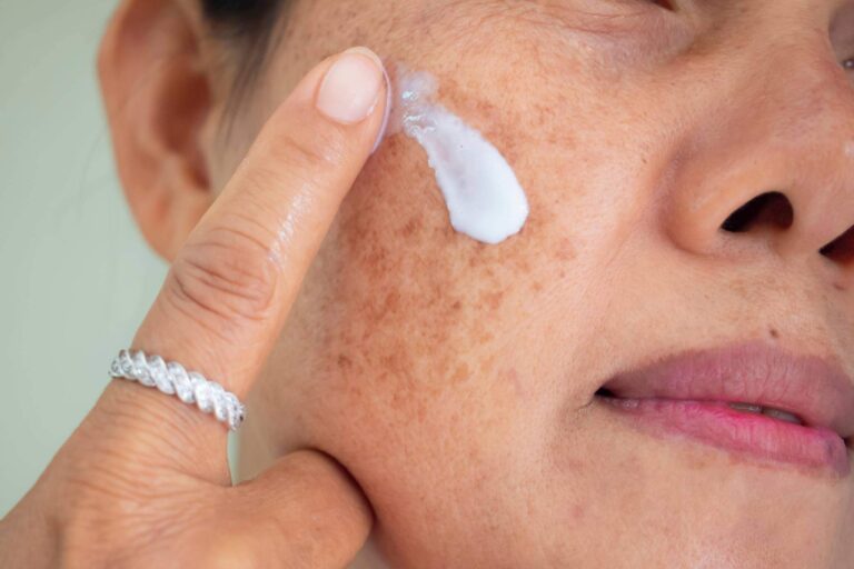 Lady Applying Face Cream